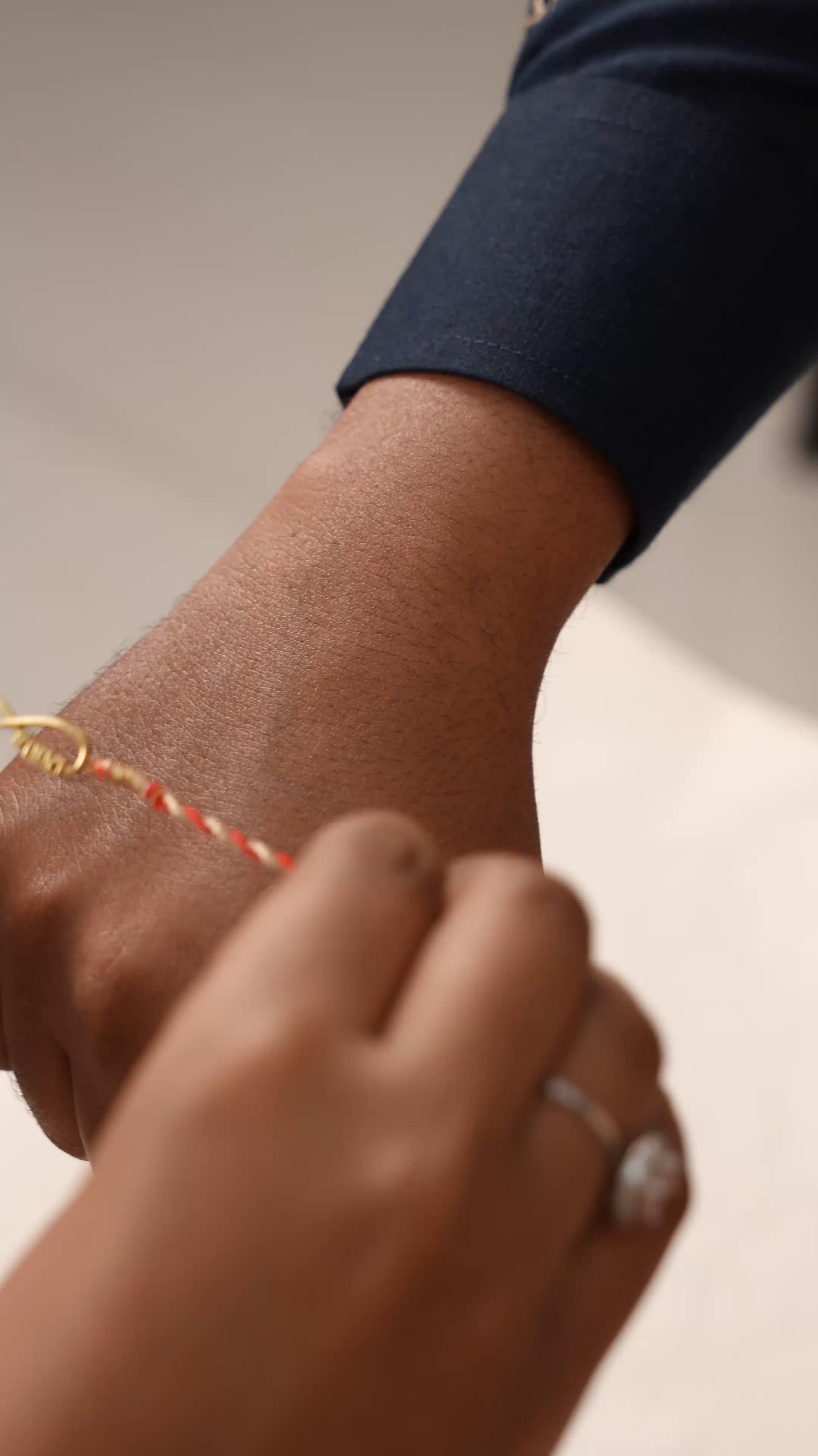 Red Twist Infinity Gold-Plated Silver Rakhi for Brother